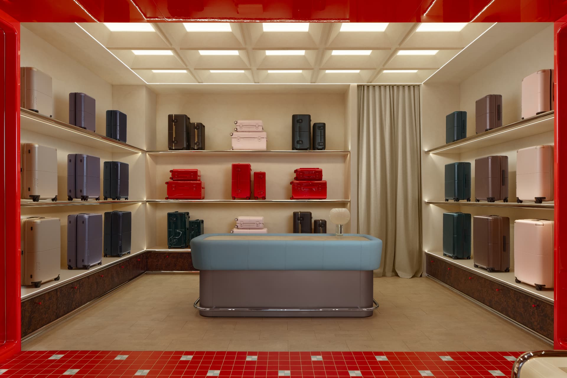 July Chadstone luggage room with red lacquer portal and mirrored shelving bays