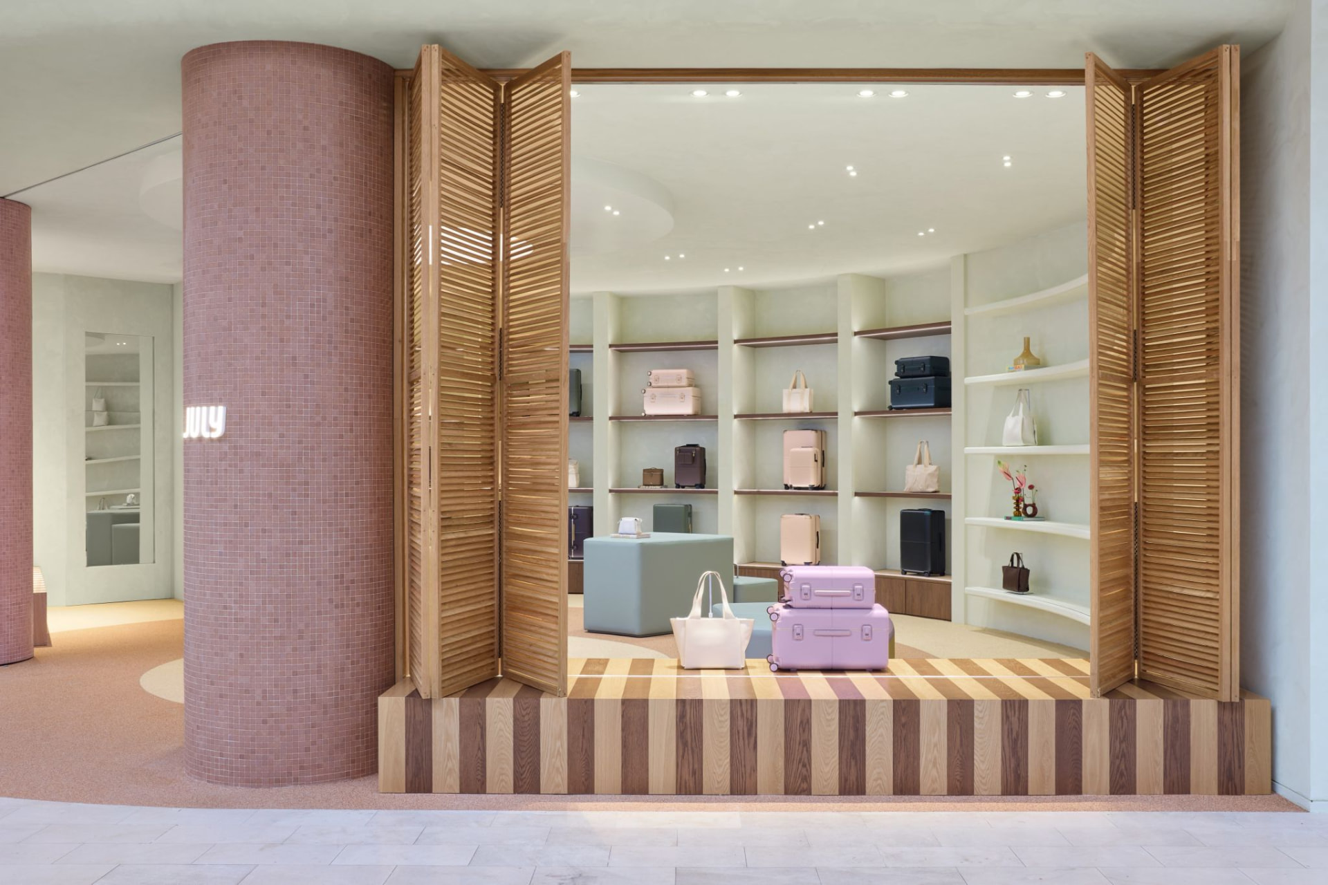 July Karrinyup shopfront with timber bi-fold louvre screens and striped oak plinth